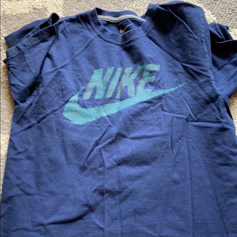 4 sports shirts 3 Nike and 1 Adidas